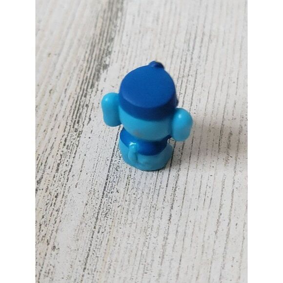 Miniature rubber elephant train conductor toy figure - Picture 3 of 4